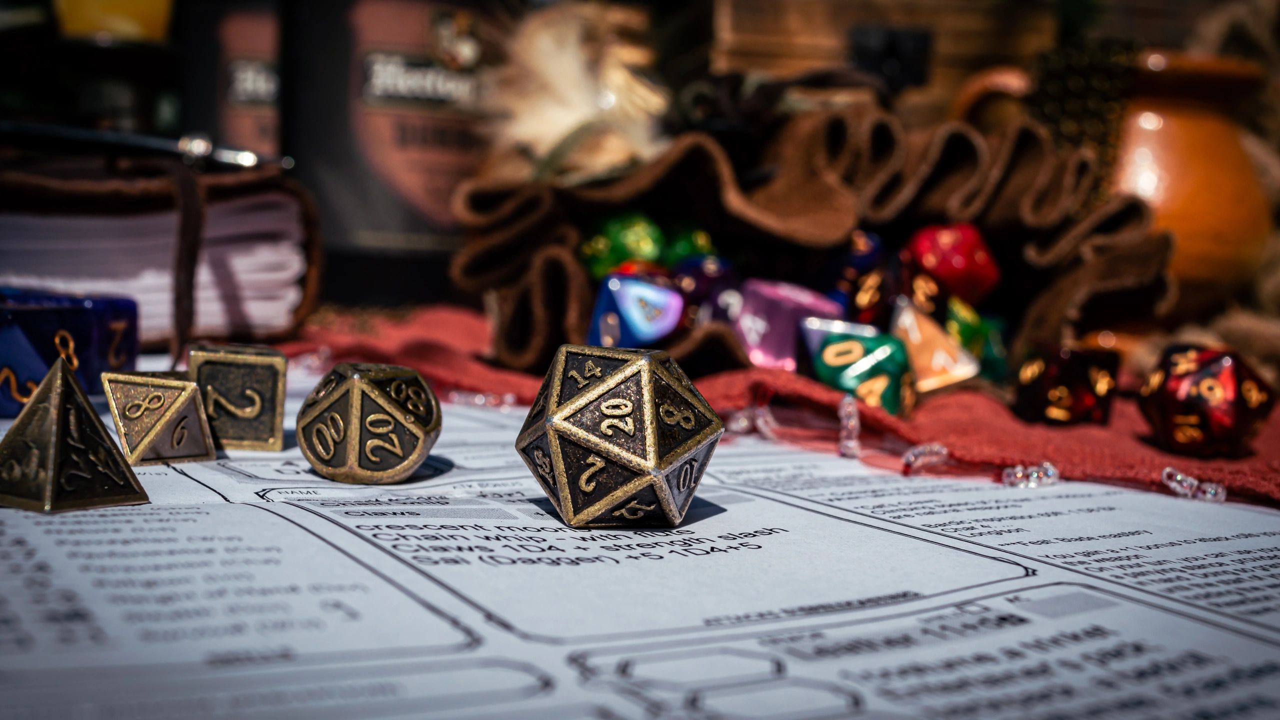 Brass twenty-sided die on a character sheet